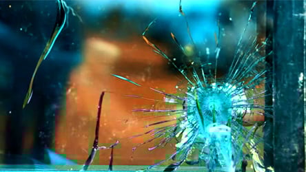 broken ballistic glass outside on shooting range